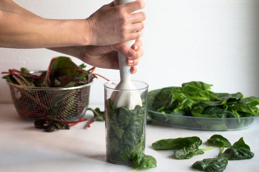 blending vegetables with hand blender